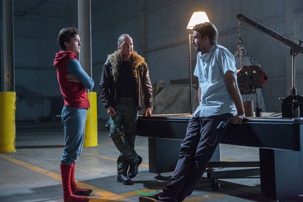 (l to r) Tom Holland, Michael Keaton, and director Jon Watts on the set of Columbia Pictures' SPIDER-MAN: HOMECOMING.