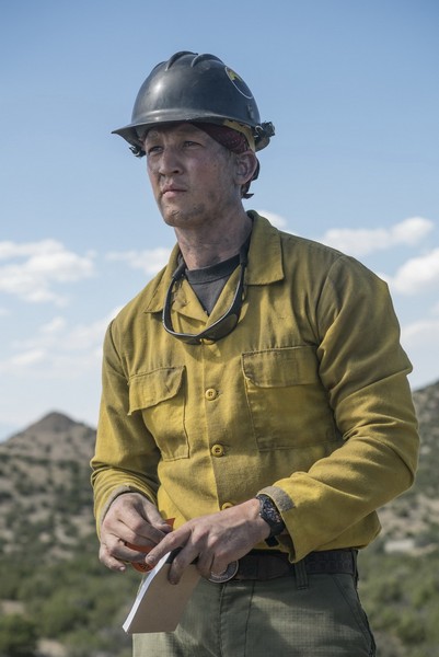 Brendan McDonough (Miles Teller) at the rocky mountain lookout surveying the advancing fire at Yarnell Hills in Columbia Pictures' ONLY THE BRAVE.