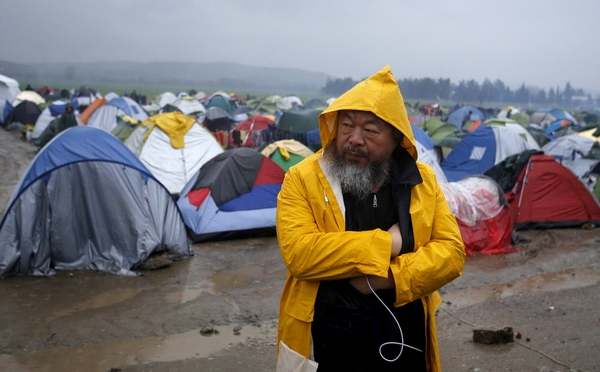 Chinese dissident artist Ai Weiwei looks on as he visits a migrant's makeshift camp on the Greek-Macedonian border, near the village of Idomeni, Greece, March 9, 2016. Ai is in Greece to shoot a documentary. REUTERS/Stoyan Nenov/File Photo